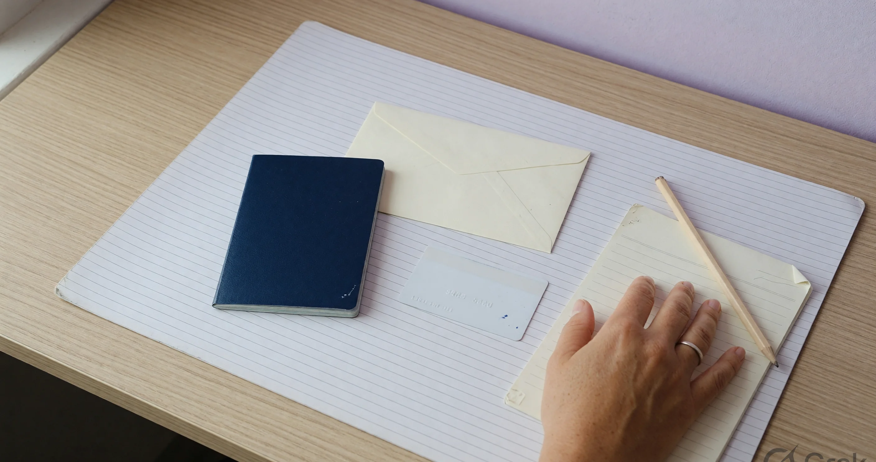 Payment and KYC desk Verification counter with closed booklet, blank envelope and face-down card