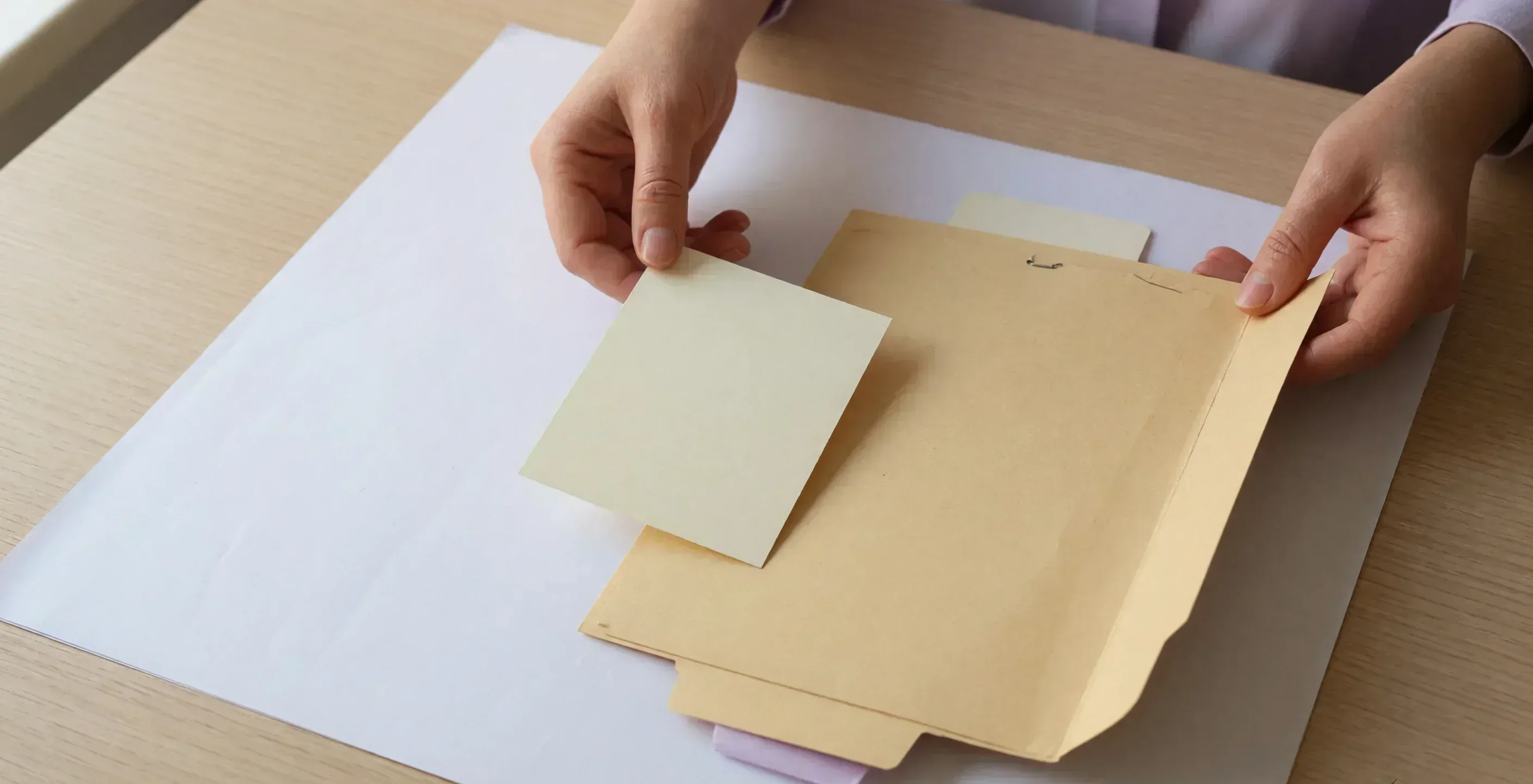 Three empty ruled lines on ivory paper with a pencil set down Three empty ruled lines on ivory paper with a pencil set down