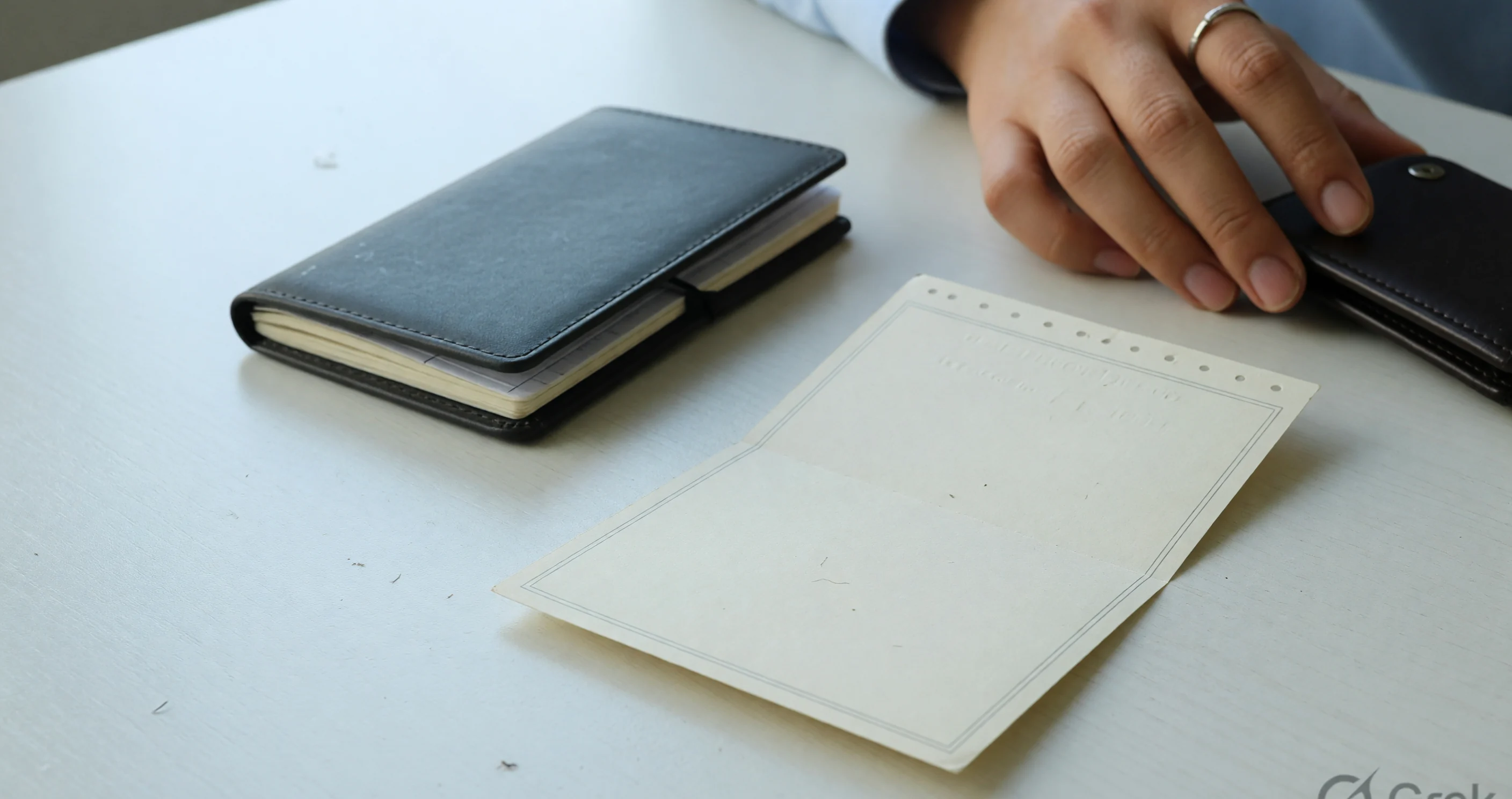 Face-down hold slip beside a closed booklet Face-down hold slip beside a closed booklet